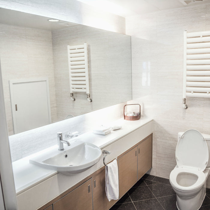 Distancias mínimas en un baño: colocación correcta de WC, toalleros y enchufes